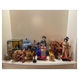 Asian figurines pottery vases and decorative collectibles at a Bellevue Estate Sale.