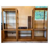 Wood and glass display cabinets with vintage stereo equipment at a Bellevue Estate Sale.