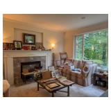 Living room with vintage furniture framed art baskets and home decor at a Bellevue Estate Sale.