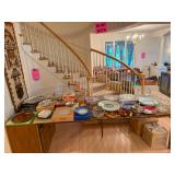 Glass serving dishes platters bowls and vintage tableware displayed at a Bellevue Estate Sale.