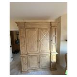 Large light-wood entertainment armoire