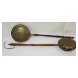 1015	2 PRIMITIVE BRASS BED WARMERS, LONGEST APPROXIMATELY 42 IN