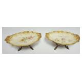 1027	OVAL CHINA DISHES W/FLORAL DECORATIONS & GILT EDGES ON METAL STAND W/DOLPHIN FEET, EACH APPROXI