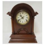 1133	WATERBURY WALNUT SHELF CLOCK W/REMOVABLE HALF MOON WOOD DOOR IN FRONT, APPROXIMATELY 1 IN X 5 I