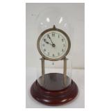 1138	ANTIQUE ANNIVERSARY CLOCK MARKED URANIA UNDER GLASS DOME, NO PENDULUM, APPROXIMATELY 14 IN HIGH