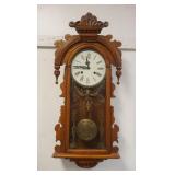 1140	WALNUT WALL CLOCK W/ARCHED TOP HAVING TURNED DROP FINIALS, APPROXIMATELY 14 IN X 6 IN X 36 IN H