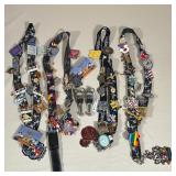 COLLECTION OF DISNEY ENAMEL PINS, LANYARDS, AND BOTTLE STOPPERS