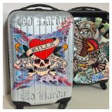 PAIR OF ED HARDY BY CHRISTIAN AUDIGIER ROLLING HARDSHELL SUITCASES