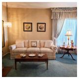 Traditional striped sofa, wood coffee table, pedestal side table and decorative lighting