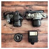 Canon PowerShot SX10 IS digital camera, Canon 35mm film camera and flash.