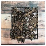 Vintage metal textile-printing stamp with detailed bird and floral motifs.