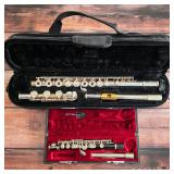 Yamaha sterling silver open-hole flute and Yamaha piccolo, each with a fitted case.
