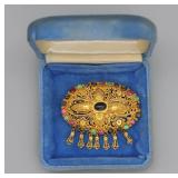 gold brooch
