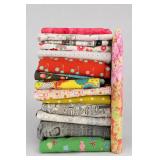Assorted Fabric Rolls Including Newspaper Print