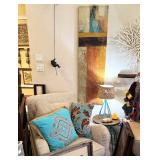 Fabric Rocking Chair, beautiful pillows, artwork and man climbing wall