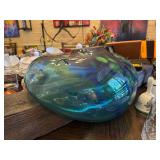 Artistic blown glass shaped around a decorative board