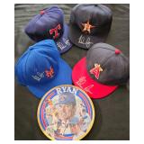 Numerous autographed baseball hats by HOFamer Nolan Ryan.