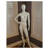 Full-body, gloss white female egghead mannequin.