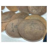 Each roll features punched holes creating musical scores, with some marked with titles like