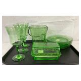 Green Glassware Including Plates, Goblets, Ice Bucket, and Butter Dish