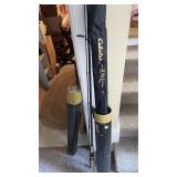 Assorted Fishing Rods with Storage Tubes and Protective Sleeves