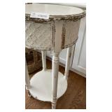 Round Distressed White Wooden Accent Table with Pressed Metal Apron Panel