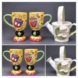 2 Whimsical Cafe Pedestal Mugs & Floral Ceramic Watering Can Lot