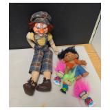 Large Clown Doll and Small Troll Dolls