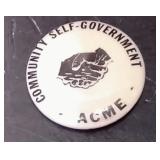 White Pinback Button Featuring The Text "COMMUNITY SELF-GOVERNMENT - ACME" And A Handshake Graphic –