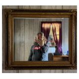 Ornate Gold-Tone Framed Wall Mirror - Decorative Scrollwork & Black Accents - Lake Odessa Off-Site