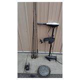 Assorted Fishing Equipment Collection with Rods, Trolling Motor, Winch, and Fish Basket
