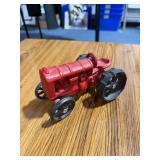 Cast Iron Red Farm Tractor Model with Black Wheels & Steering Wheel