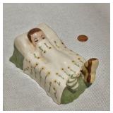 Ceramic Boy in Bed Figure
