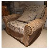 Elegant Woven Wicker Armchair with Ornate Floral Damask Upholstery & Accent Pillow