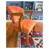 we have 2 of these colorful chairs