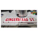 GINGERBREAD ST METAL SIGN