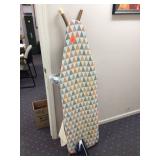 Ironing board with iron and hanger