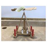 Wooden candle holder shaped like an angel with fan wings