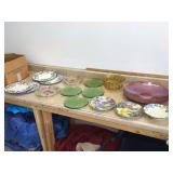 Artistic tableware featuring decorative plates dishes and a amber glass