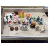 Diverse collection of decorative salt and pepper shakers and figurines