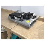 Trimmed gray plastic tarp