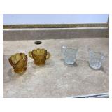 Amber and clear glass cream and sugar sets are elegant serving pieces typically used for