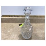 Elegant glass decanter with thumbprint design