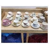 Varied decorative teacups with matching saucers