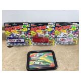 Three racing semi trucks with a NASCAR plaque