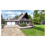 Three bedroom Chalet home on 40 acres and pole Barn and 2 Artesian wells