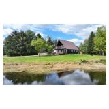 Three bedroom Chalet home on 40 acres and pole Barn and 2 Artesian wells