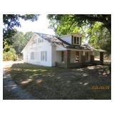 NICE 1-1/2 STORY VINYL SIDING HOUSE, DETACHED 2 CAR GARAGE/WORKSHOP, STORM SHELTER, STORAGE BL& LOT