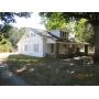 NICE 1-1/2 STORY VINYL SIDING HOUSE, DETACHED 2 CAR GARAGE/WORKSHOP, STORM SHELTER, STORAGE BL& LOT