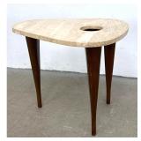 Lot 759  Modernist Travertine Triangle Guitar Pick Side Table. Top has cut out. 
